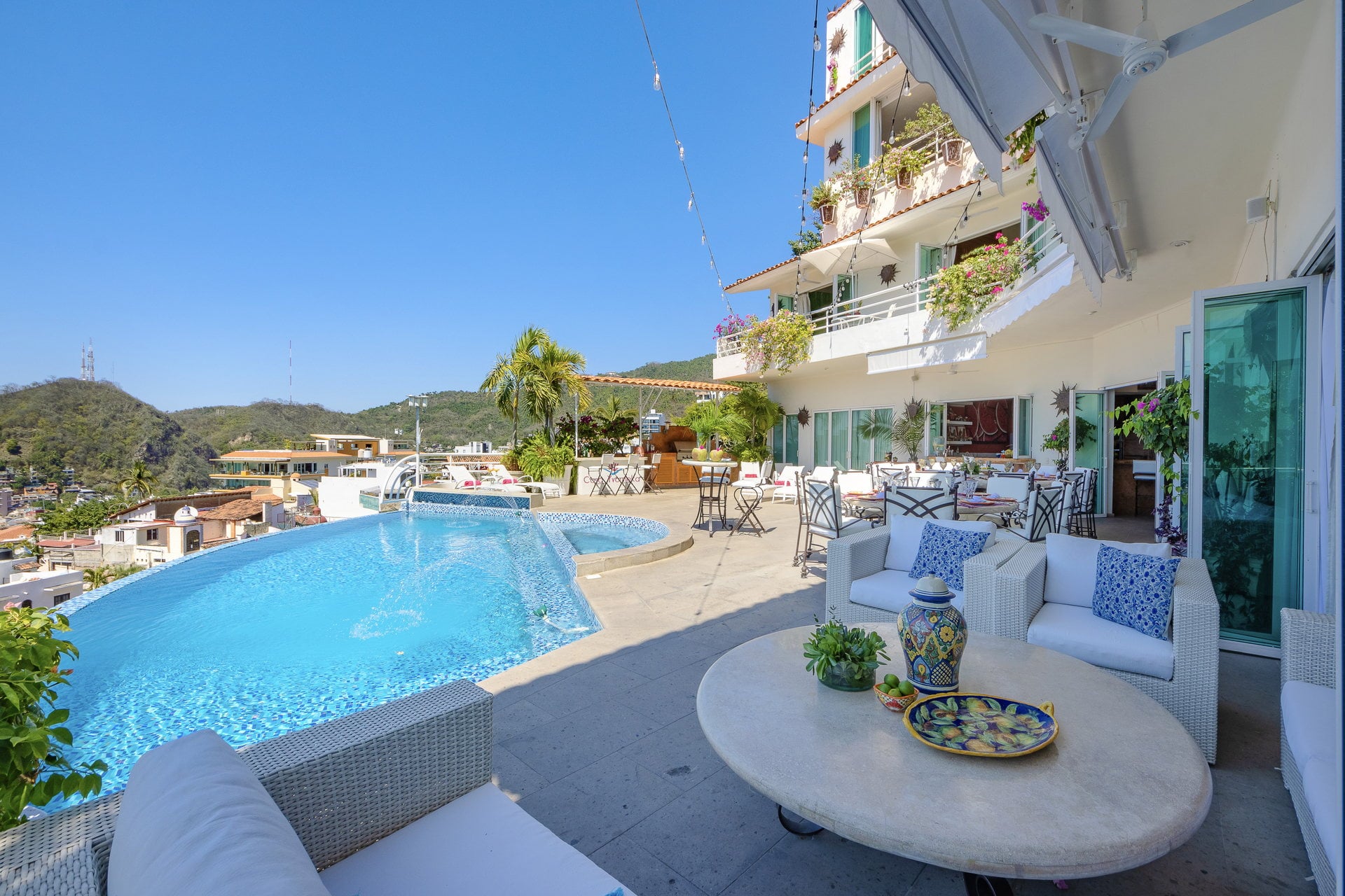 Villa Yvonneka curved pool with round cushioned lounge and deck — Puerto Vallarta, Mexico