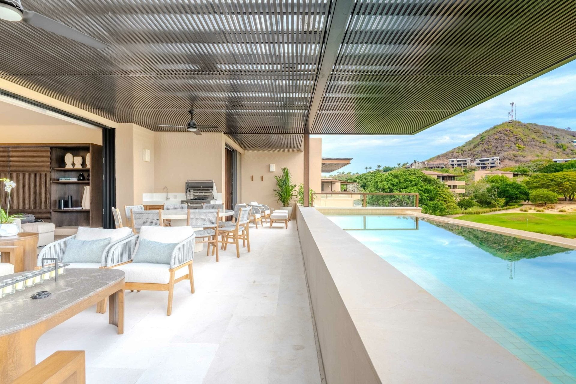 Condo 7 Eight Tukipa 405 covered terrace and pool facing a green fairway — Punta Mita Nayarit, Mexico